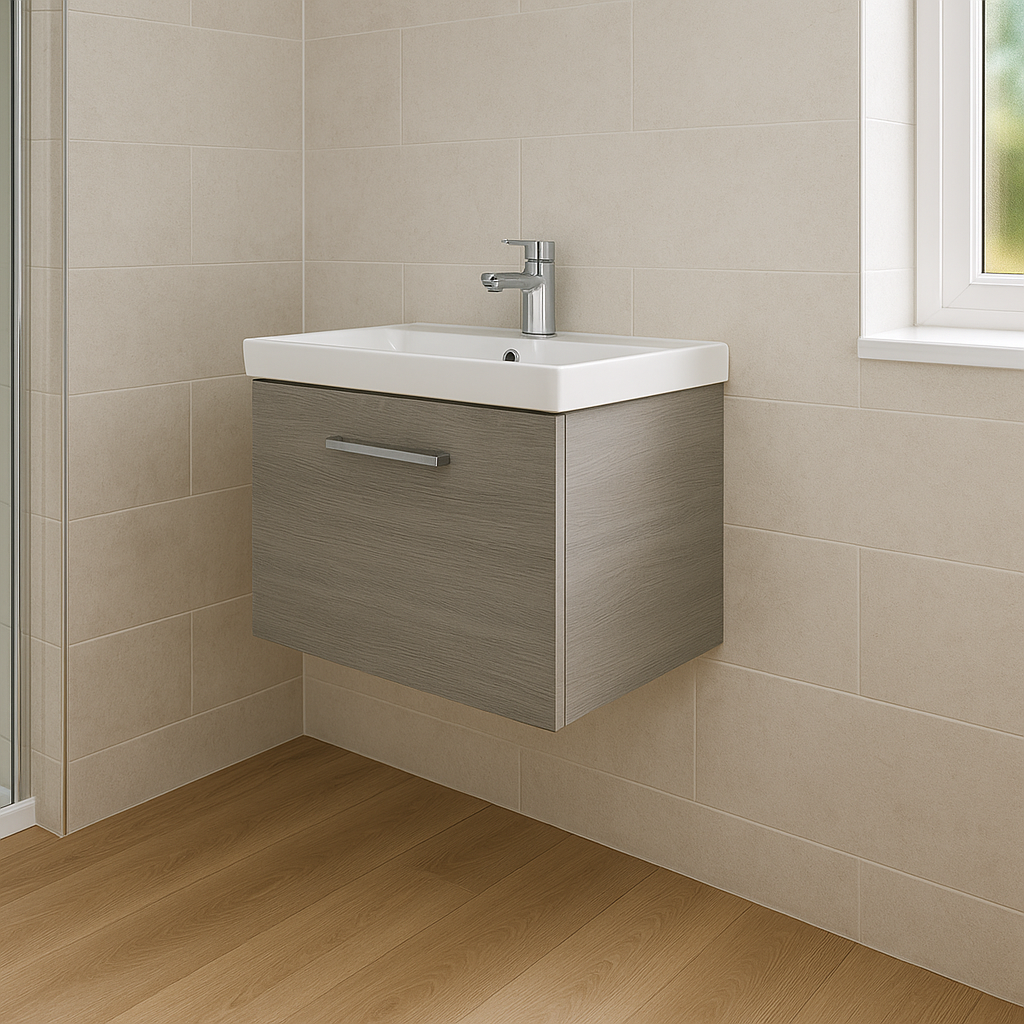 Wall-hung grey bathroom vanity unit with white basin and chrome tap in a modern bathroom.
