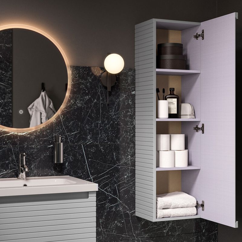 Modern bathroom with illuminated round mirror, wall-mounted vanity unit, and open tall storage cabinet in matte grey finish.