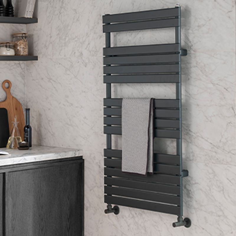 Anthracite towel radiator with horizontal slats mounted on marble wall – ideal for modern bathroom heating and towel warming.
